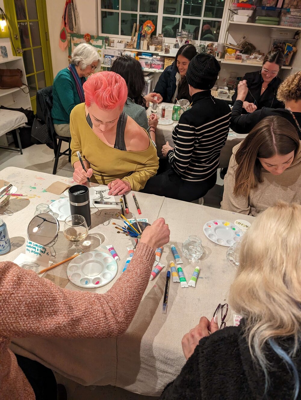 A woman working on a themed therapeutic art project in a Create Heal Grow workshop at Pachis art studio, Linda Vista